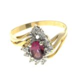 A pink tourmaline and diamond cluster ring.Stamped 14K.Ring size O.