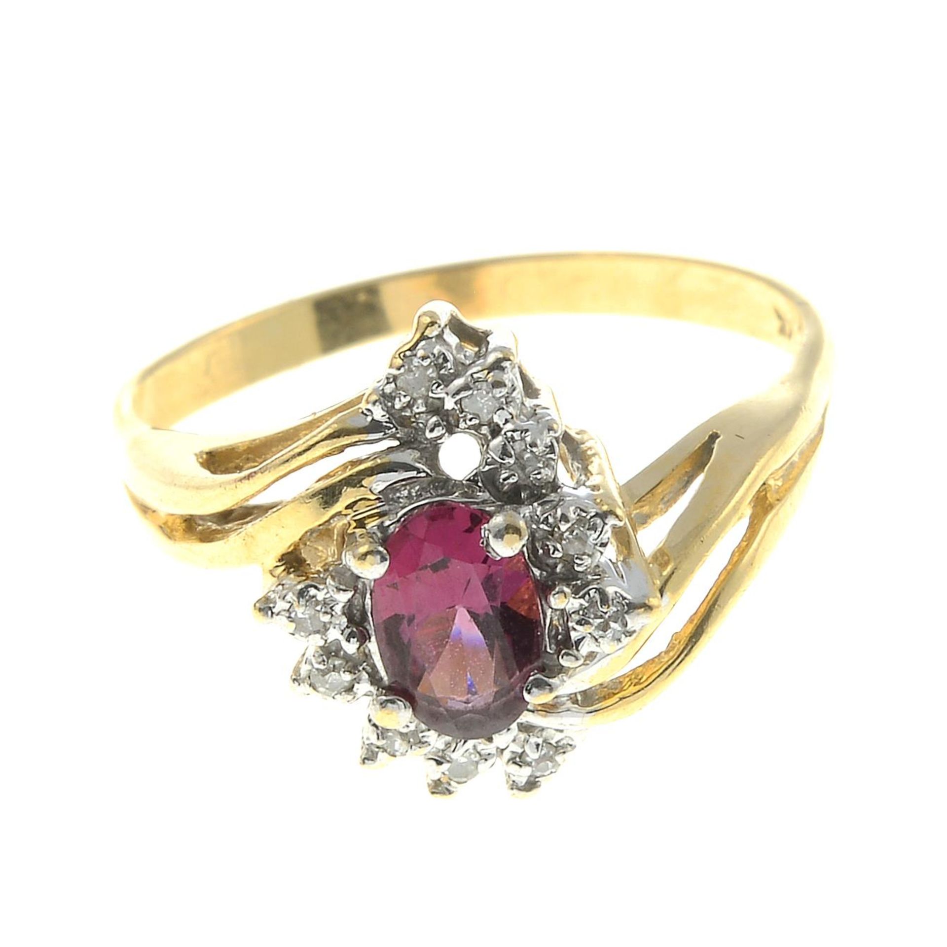 A pink tourmaline and diamond cluster ring.Stamped 14K.Ring size O.