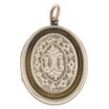 An engraved locket.Length 4.3cms.