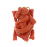 A carved coral pendant.Length 3.9cms.