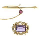 An amethyst and split pearl brooch and a ruby and split pearl brooch.