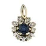 A sapphire and diamond pendant.Stamped 585.Length 1.7cms.