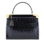 A vintage polished crocodile skin handbag.