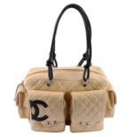 CHANEL - a beige Ligne Cambon reporter handbag.