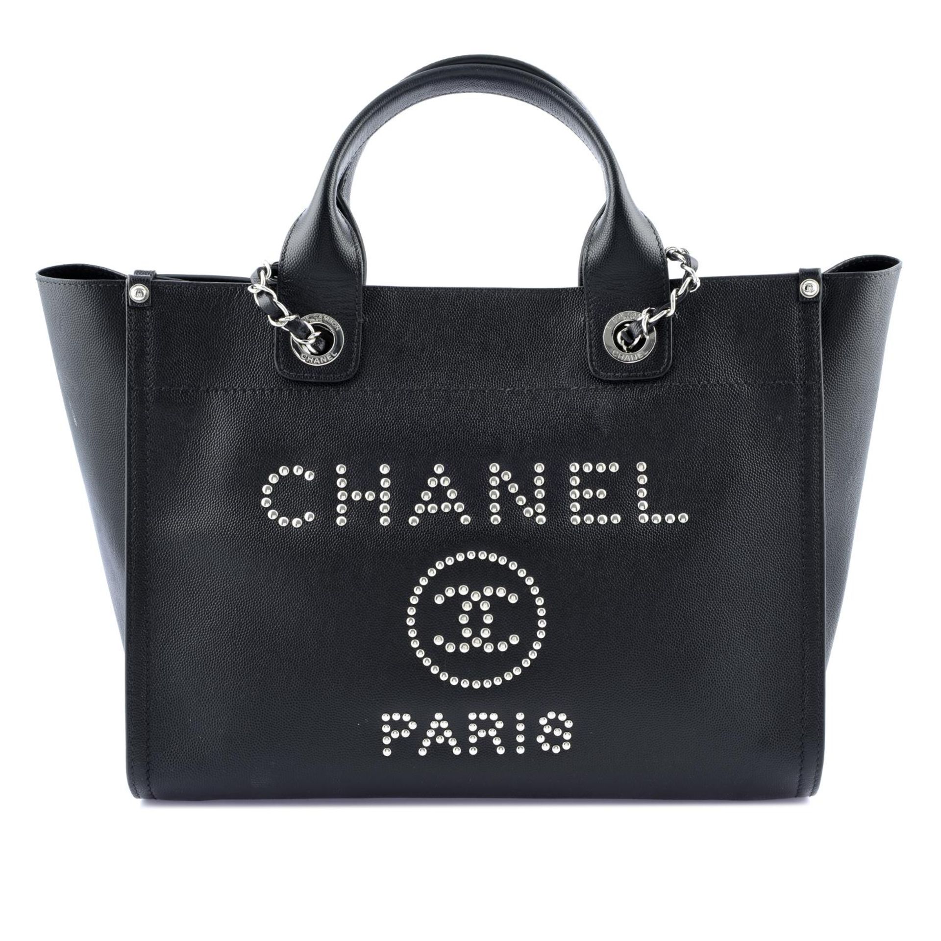 CHANEL - a black Studded Deauville Tote handbag.