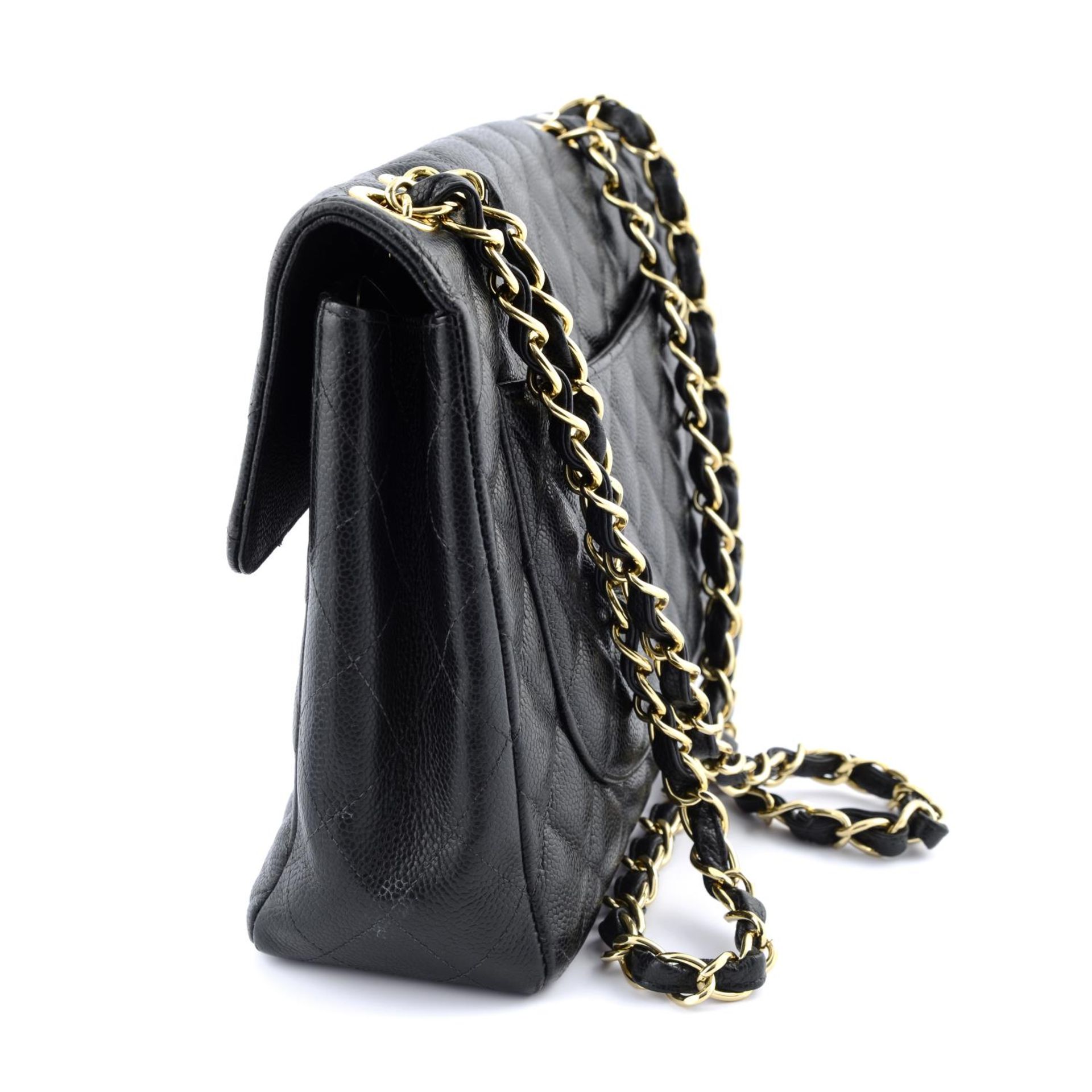 CHANEL - a Jumbo Caviar Classic Flap handbag. - Bild 3 aus 4