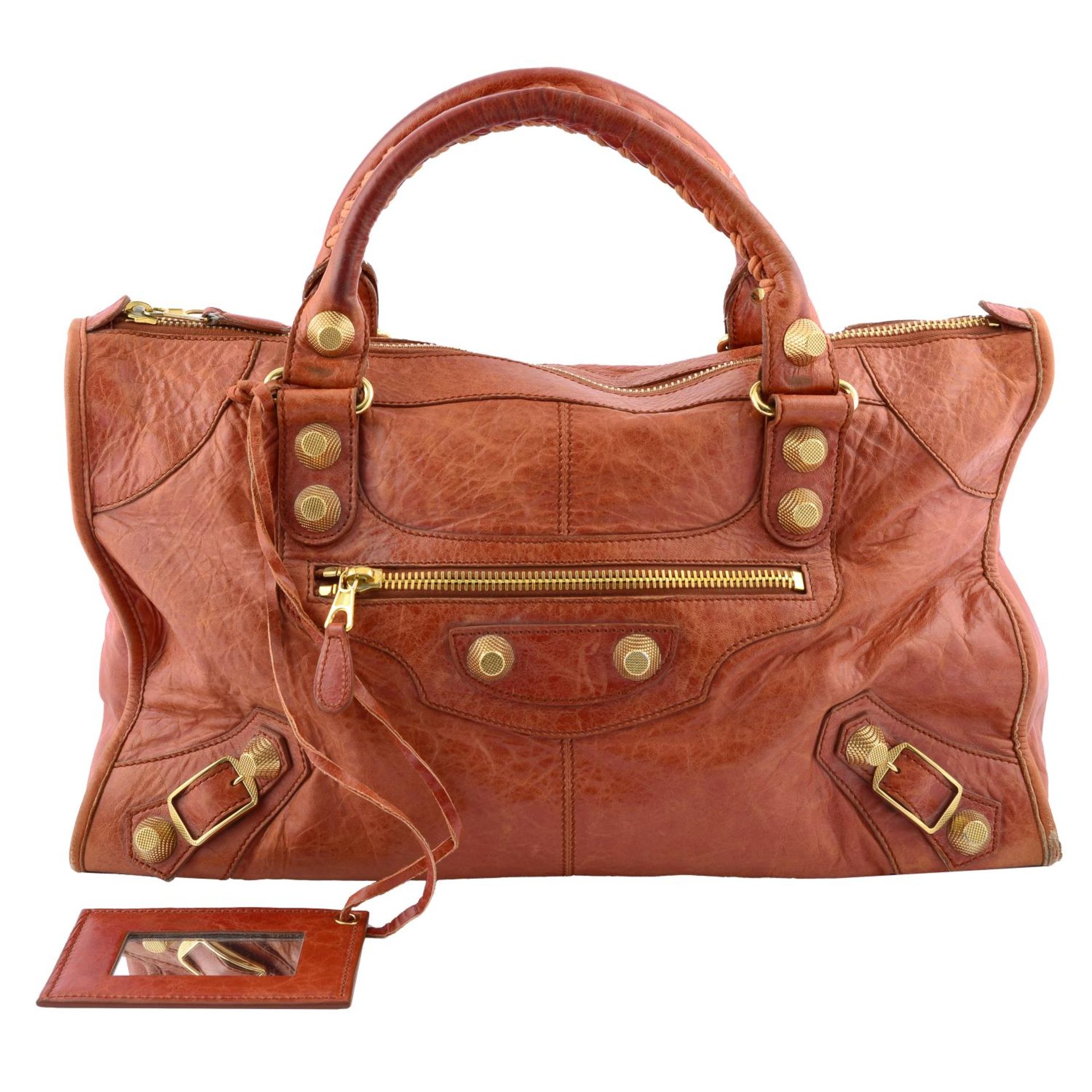 BALENCIAGA - a dark orange Giant Work handbag.