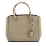 MICHAEL KORS - a light beige leather handbag.