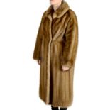 A knee-length pastel mink coat.