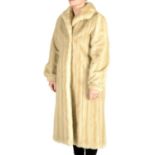 A pearl mink calf-length coat.