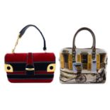 Two handbags. To include a red and blue velvet handbag and a large canvas handbag with printed
