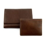 OMEGA - a brown leather wallet and matching card holder.