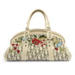 CHRISTIAN DIOR - an embroidered Diorissimo canvas handbag.