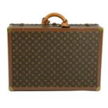 LOUIS VUITTON - a Monogram Bisten 60 hard suitcase.