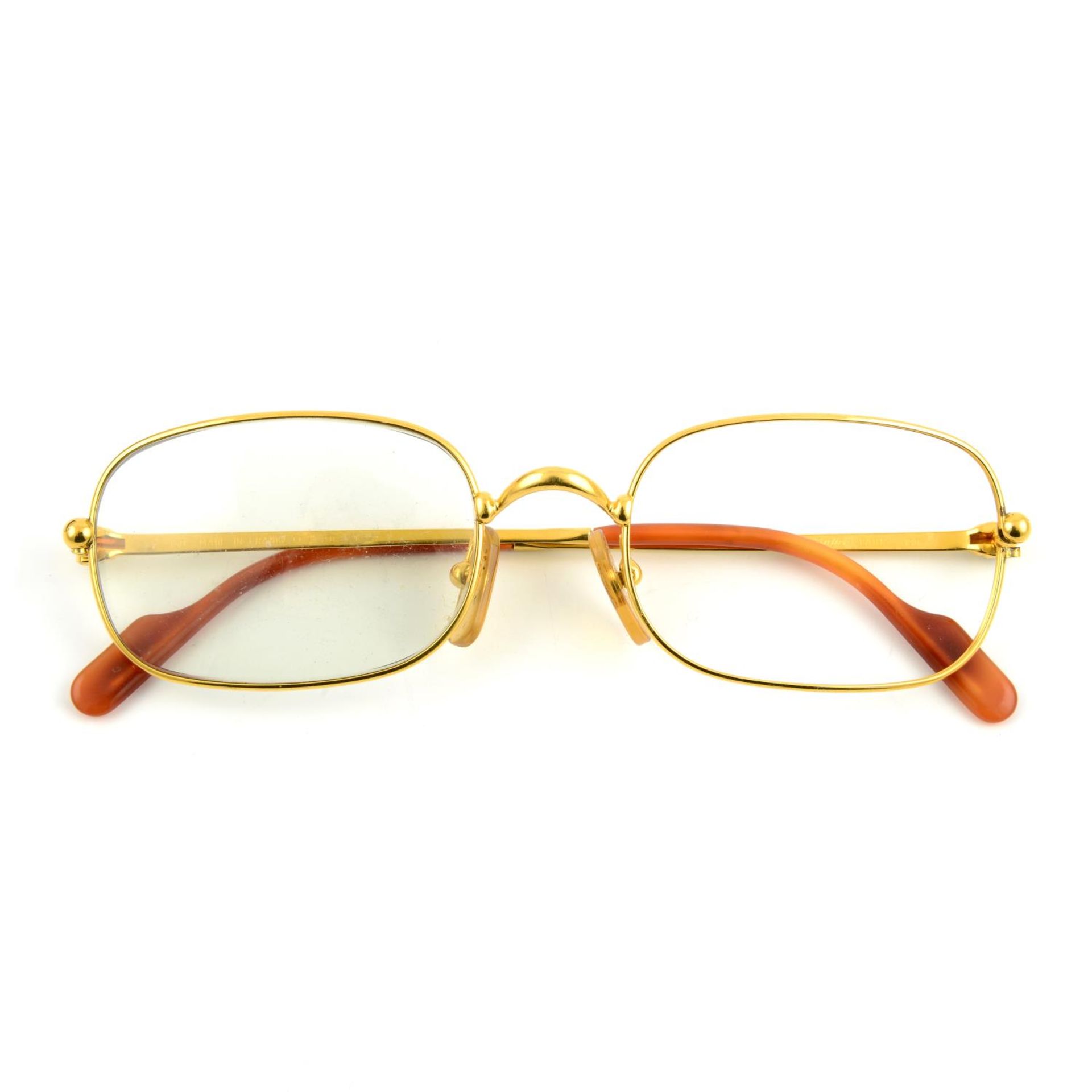 CARTIER - a pair of gold-plated prescription glasses.