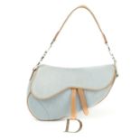 CHRISTIAN DIOR - a blue denim saddle handbag.