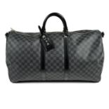 LOUIS VUITTON - a Damier Graphite Keepall Bandoulière 55 travel bag.