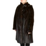 SAGA - a knee-length ranch mink hooded coat.