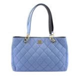 CHANEL - a light blue quilted handbag.