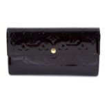 LOUIS VUITTON - an Amarante Monogram Vernis Porte Tresor International wallet.