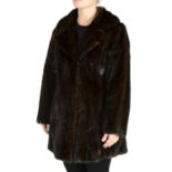 A three-quarter length dark ranch mink coat.