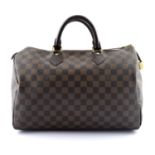 LOUIS VUITTON - a Damier Ebene Speedy 35 handbag.