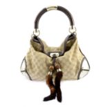 GUCCI - an Indy Mink Tassel handbag.