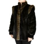 A black mink jacket with striped trim.