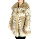 A three-quarter length lynx fur coat.