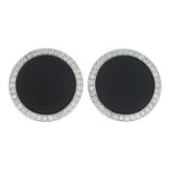 A pair of onyx and brilliant-cut diamond cufflinks.Total diamond weight 0.74ct,