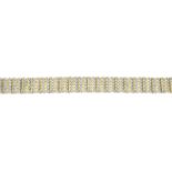 An 18ct gold brilliant-cut diamond bracelet.Estimated total diamond weight 2.90cts.Import marks for
