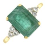 An 18ct gold emerald and brilliant-cut diamond ring.Emerald calculated weight 3.64cts,