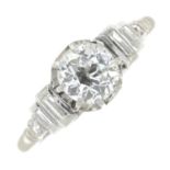 A mid 20th century platinum old-cut diamond single-stone ring, with vari-cut diamond shoulders.