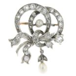 An early 20th century silver and gold, diamond and pearl brooch.