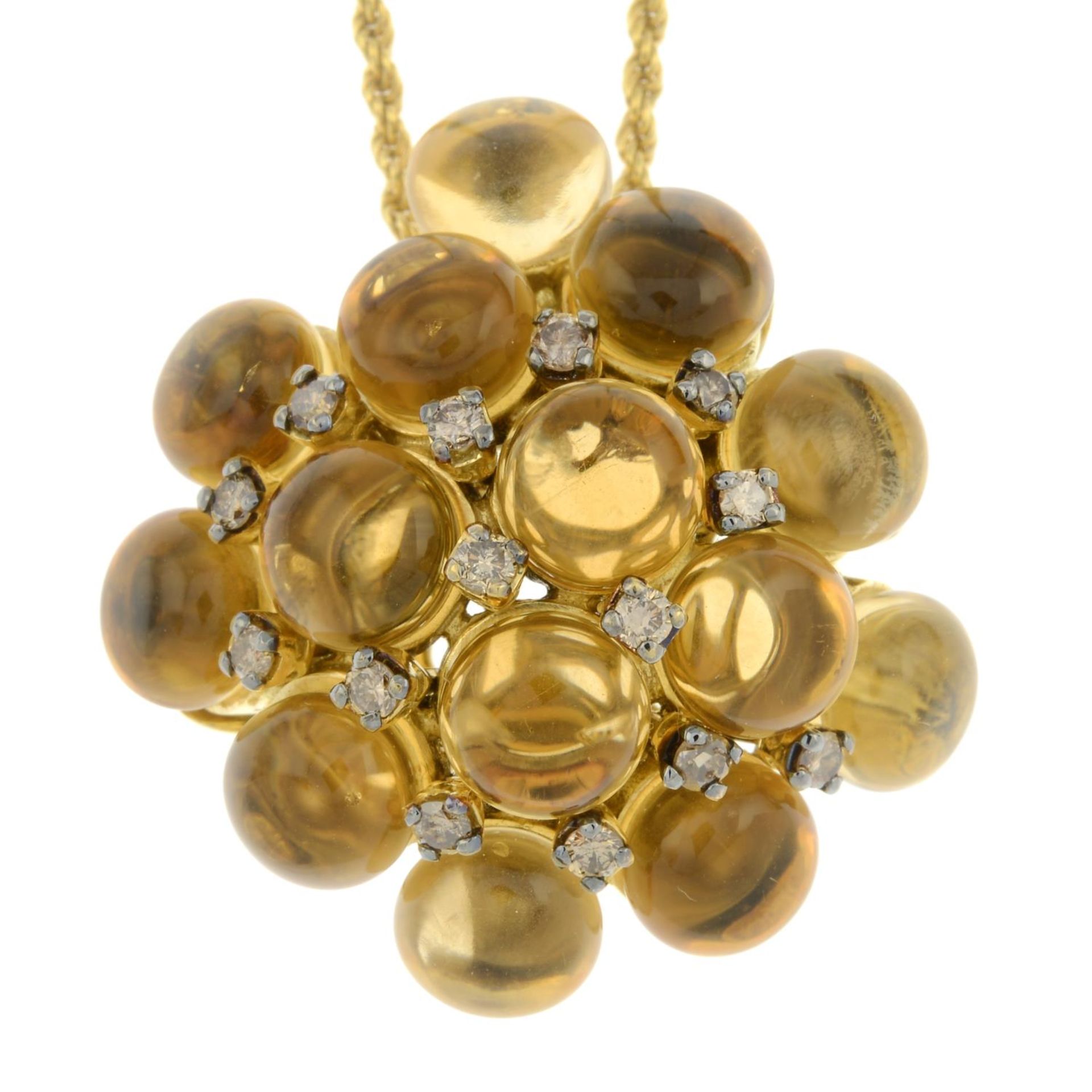 A circular citrine cabochon and brilliant-cut diamond cluster pendant,