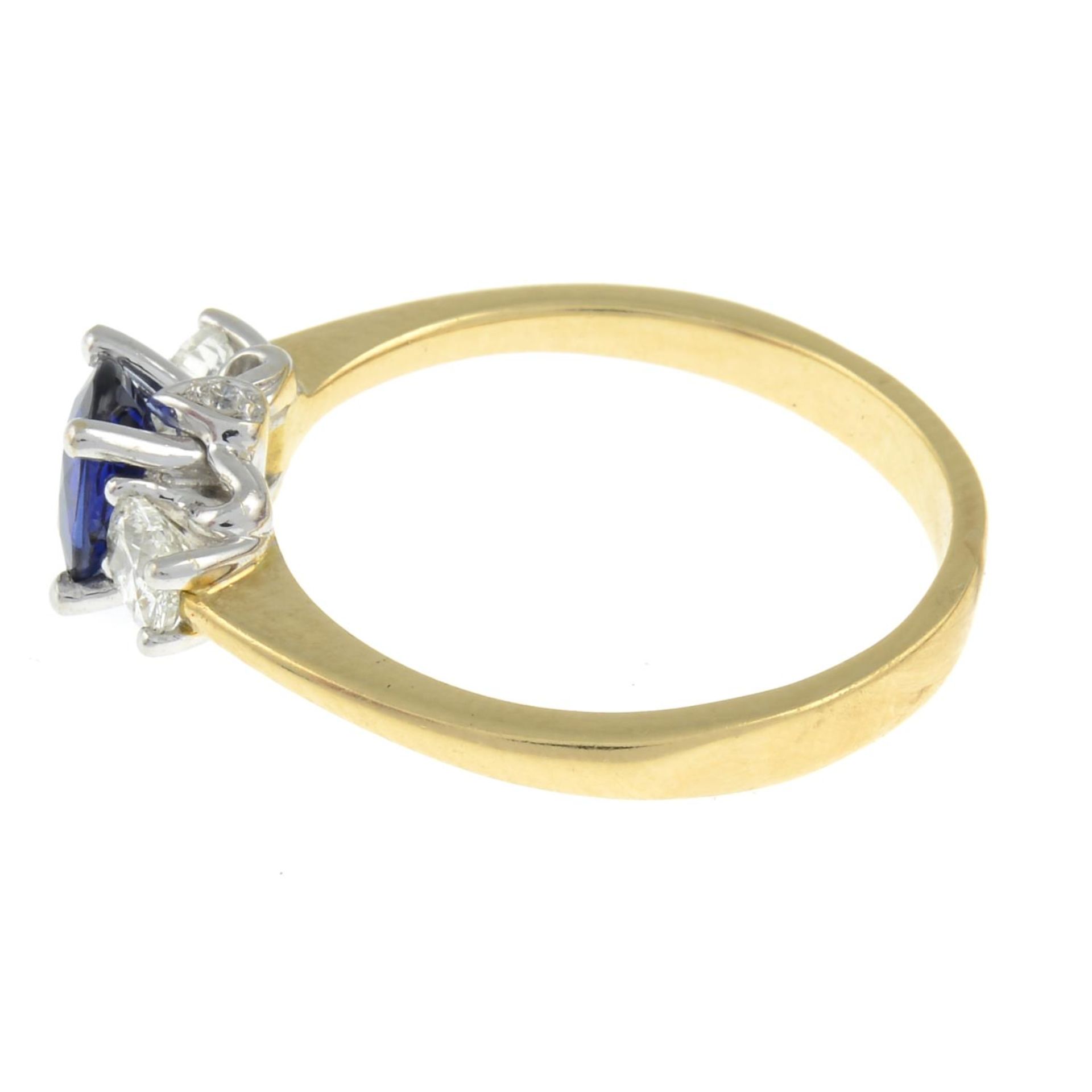 A sapphire and diamond three-stone ring, with diamond accent gallery. - Image 2 of 3