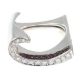 An 18ct gold ruby and brilliant-cut diamond scroll ring.Estimated total diamond weight 0.25ct.