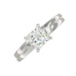 A square-shape diamond single-stone ring, with baguette-cut diamond accent shoulders.