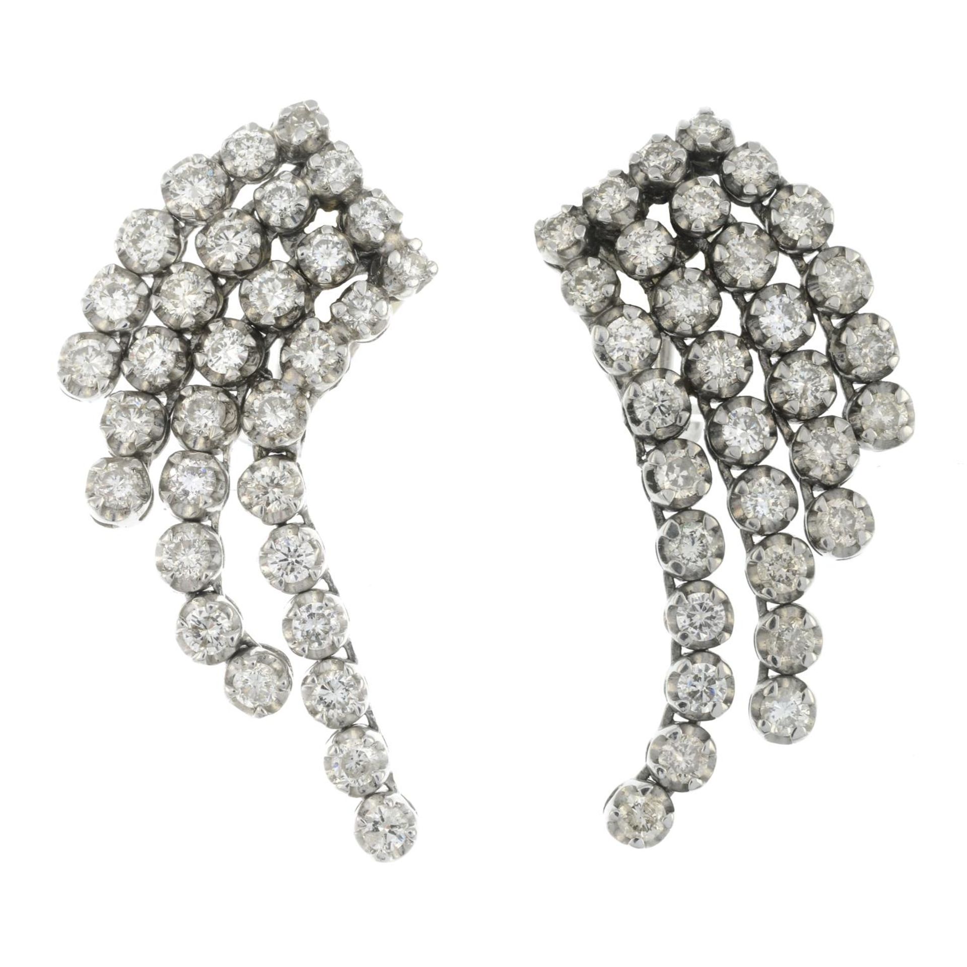 A pair of brilliant-cut diamond earrings.Total diamond weight 3.10cts,