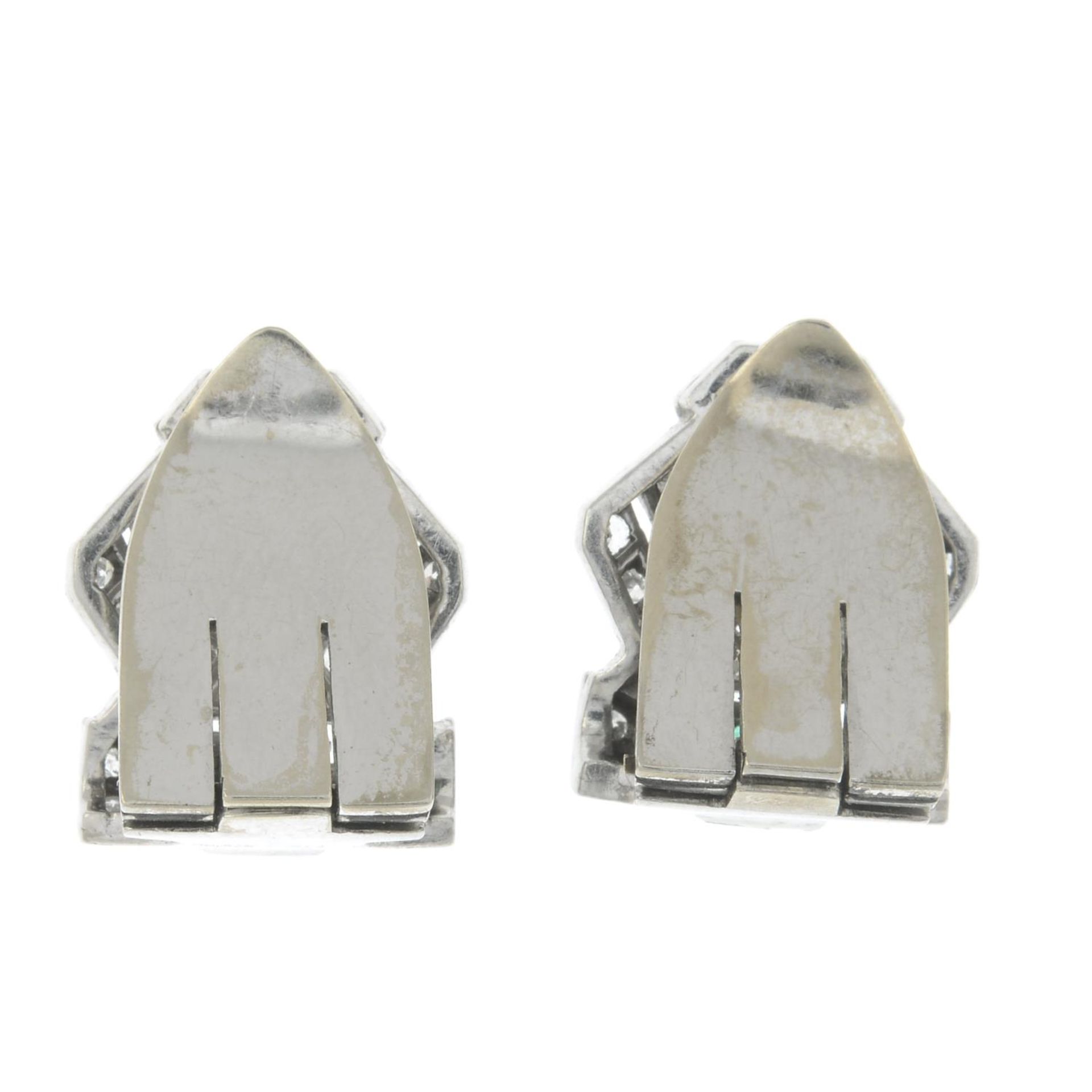 A pair of Art Deco Platinum single-cut diamond and emerald clips.Estimated total diamond weight - Image 2 of 2