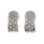 A pair of pave-set diamond earrings.Estimated total diamond weight 0.30ct.