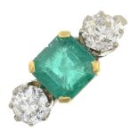 An 18ct gold emerald and old-cut diamond three-stone ring.Emerald calculated weight 1.46cts,