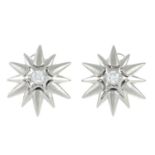 A pair of 18ct gold brilliant-cut diamond star earrings.