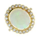 An opal cabochon and brilliant-cut diamond cluster ring.Approximate opal dimensions of 14 by 11.9