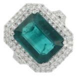 A synthetic emerald and brilliant-cut diamond dress ring.Estimated total diamond weight