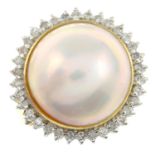 A mabe pearl and brilliant-cut diamond cluster ring.Approximate dimensions of mabe pearl 4.7 by