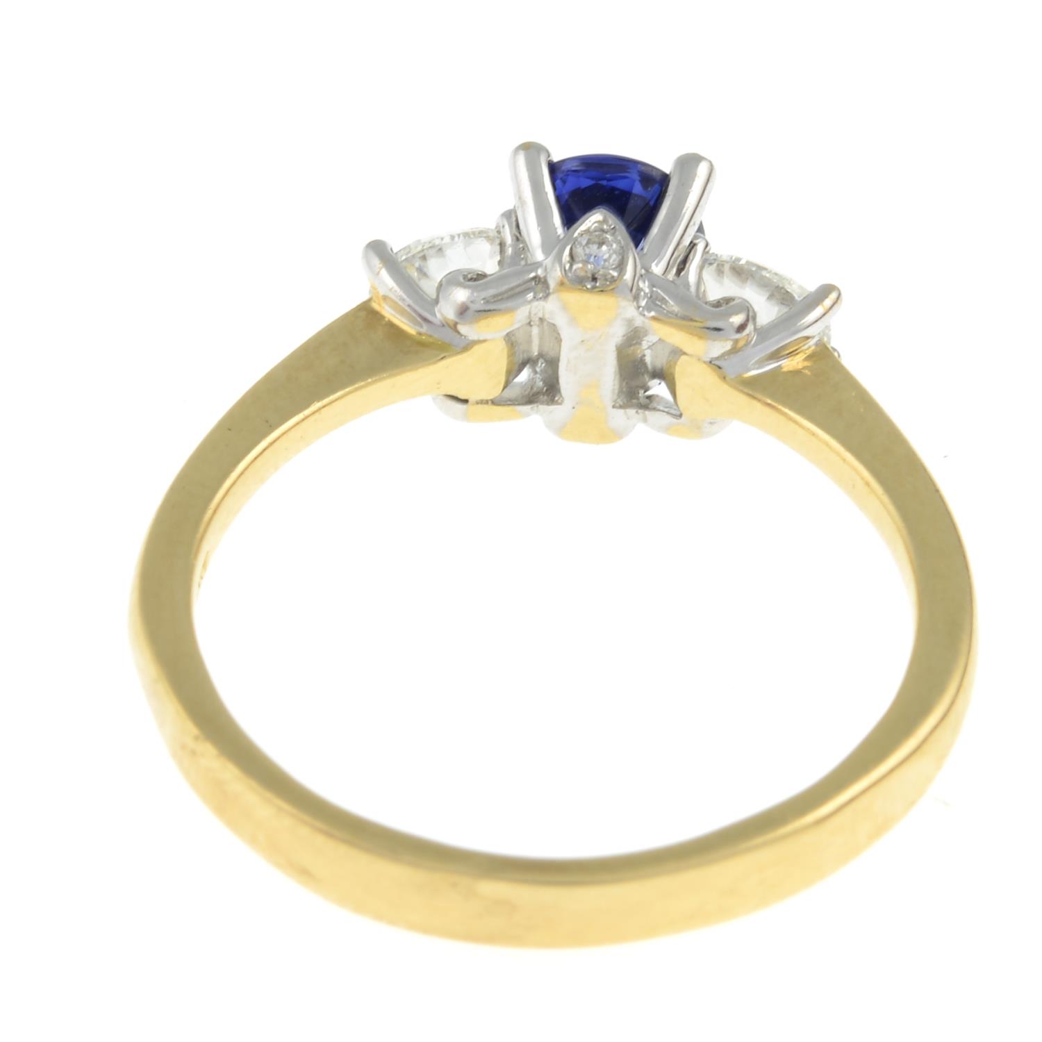 A sapphire and diamond three-stone ring, with diamond accent gallery. - Image 3 of 3