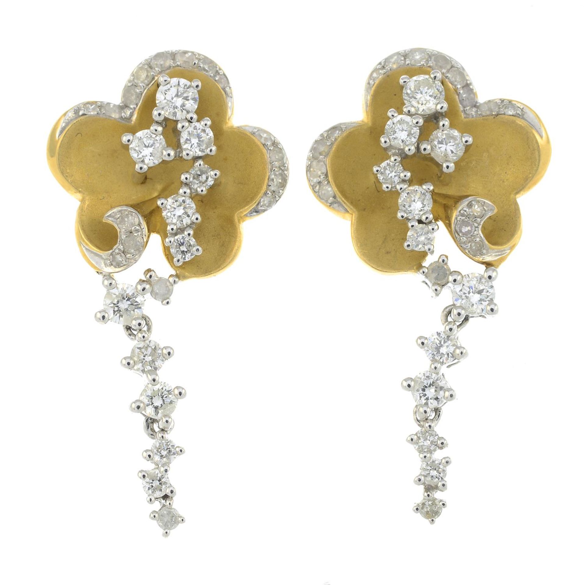 A pair of 18ct gold diamond floral earrings.Total diamond weight 0.63ct,