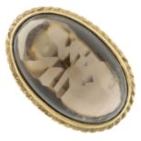 A 1970s 9ct gold oval smoky quartz cabochon single-stone ring.