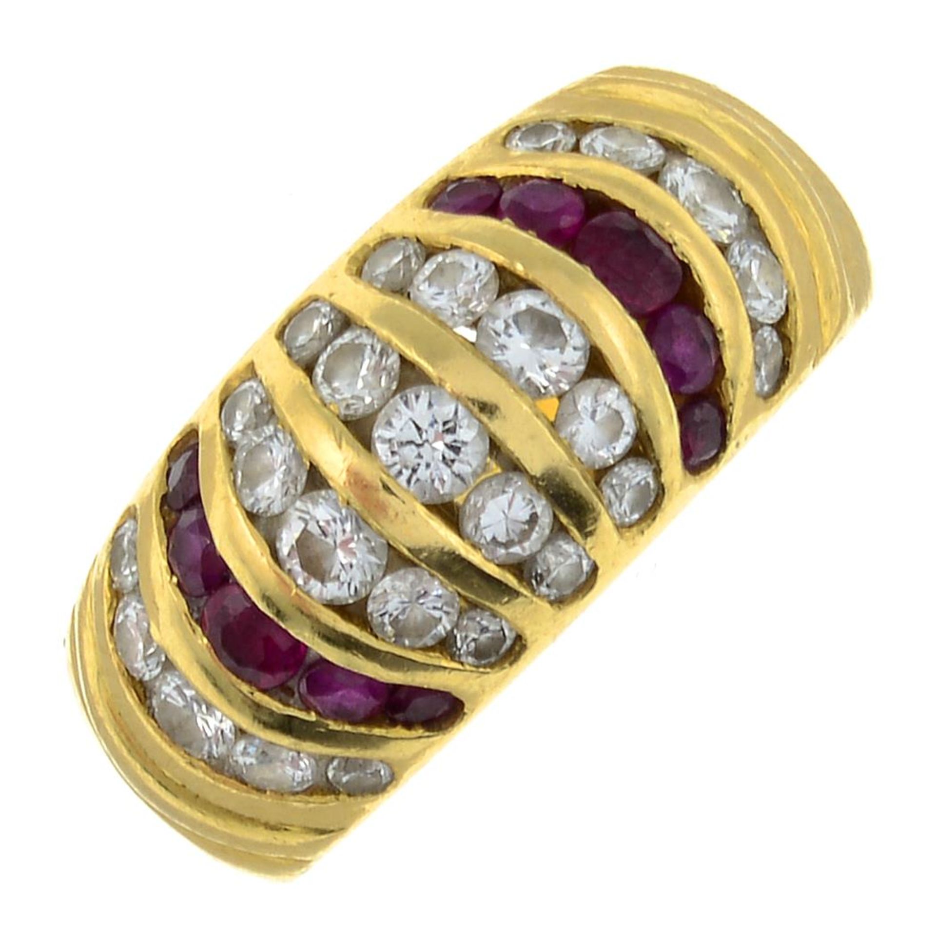 A brilliant-cut diamond and ruby dress ring.Estimated total diamond weight 0.50ct.Stamped 750.Ring